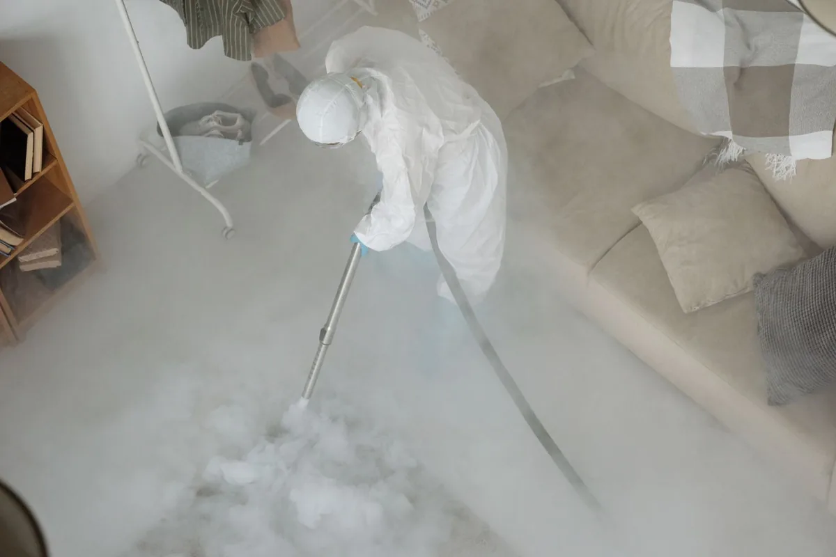 Biohazard cleanup technician in protective equipment, Southwest Hills, Portland, OR